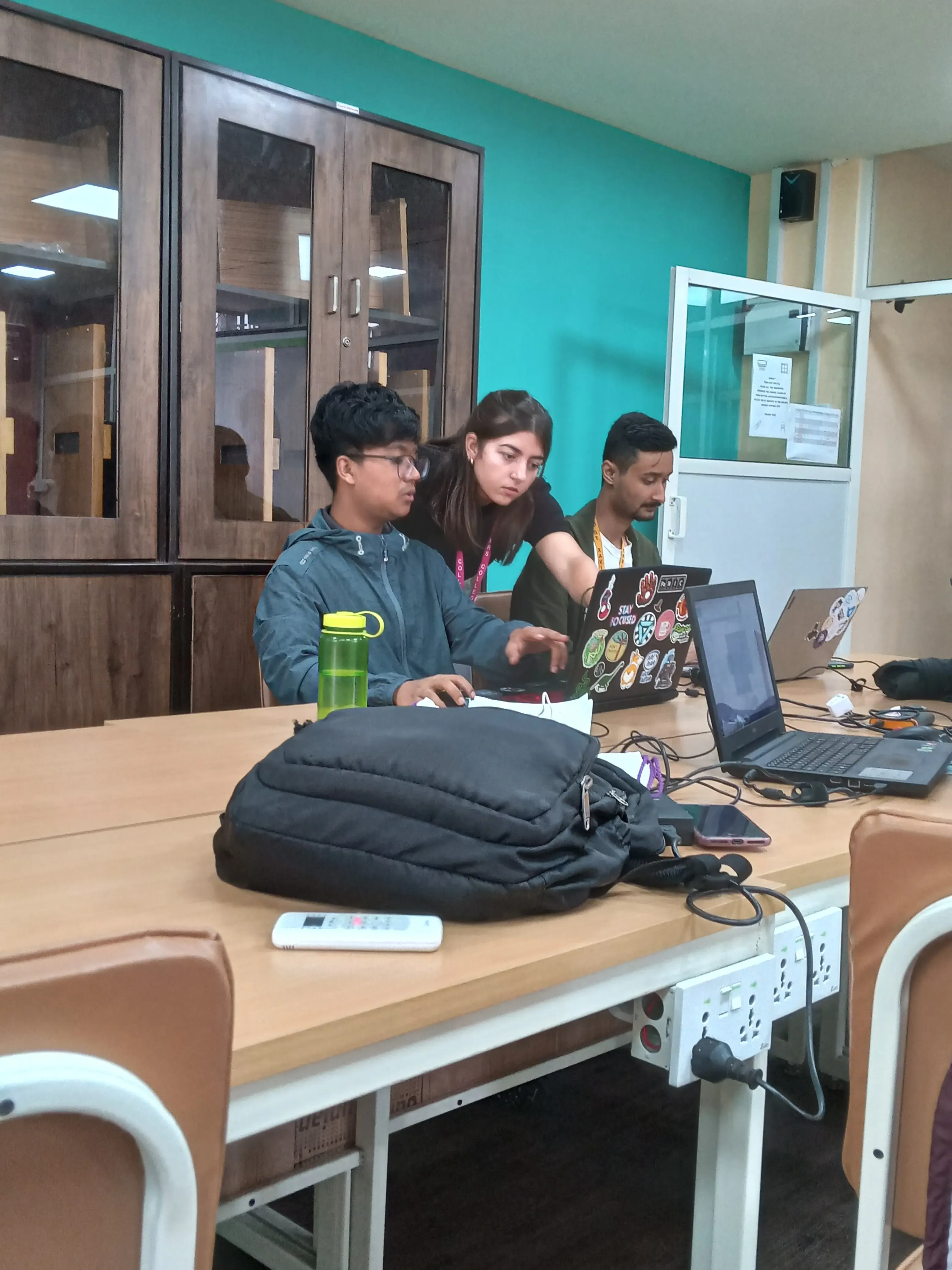 A picture where intern design instructor is guiding one of the 3D design team.