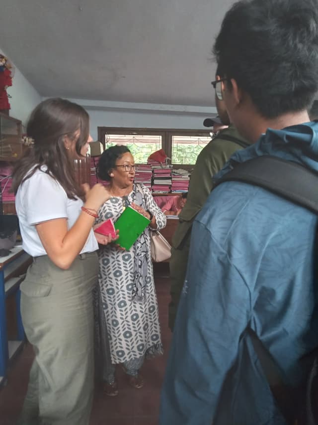 A picture where Ex-coordinator Mina ma'am of Lab School explaining the dedicated team andintern design instructor.