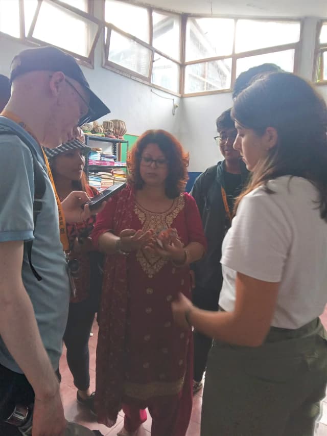 A picture where Blind Section coordinator Samita ma'am of Lab School explaining the dedicated team and intern design instructor.