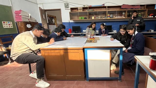 Each project members are being seated with students to carry out pre/post assessment forms.