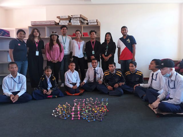 A group picture of all the participating children, international interns, project interns from BBS department and CFC members. In front, the 3D geometrical shapes made by children are displayed.