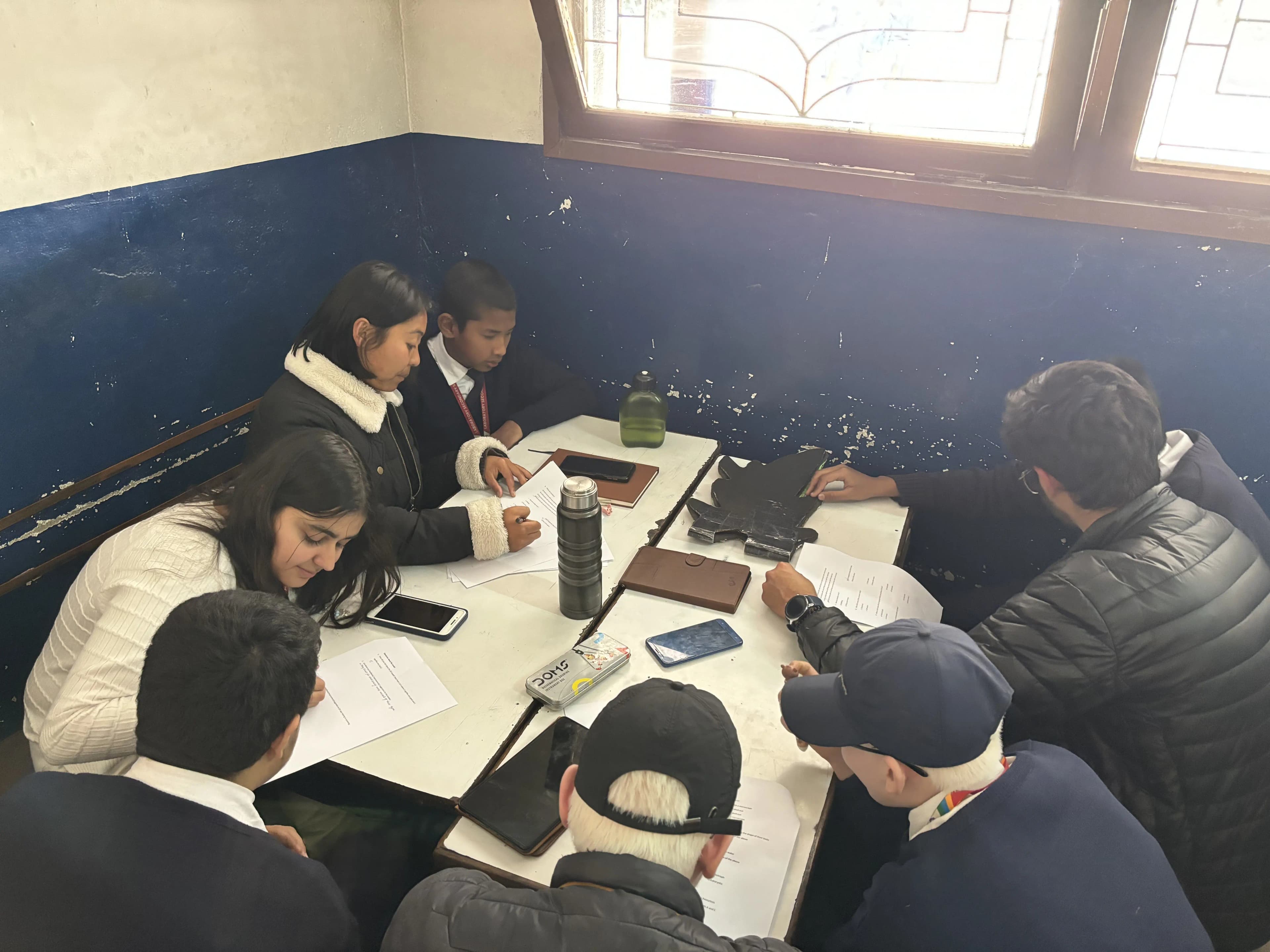 Each project members are being seated with students to carry out pre/post assessment forms.