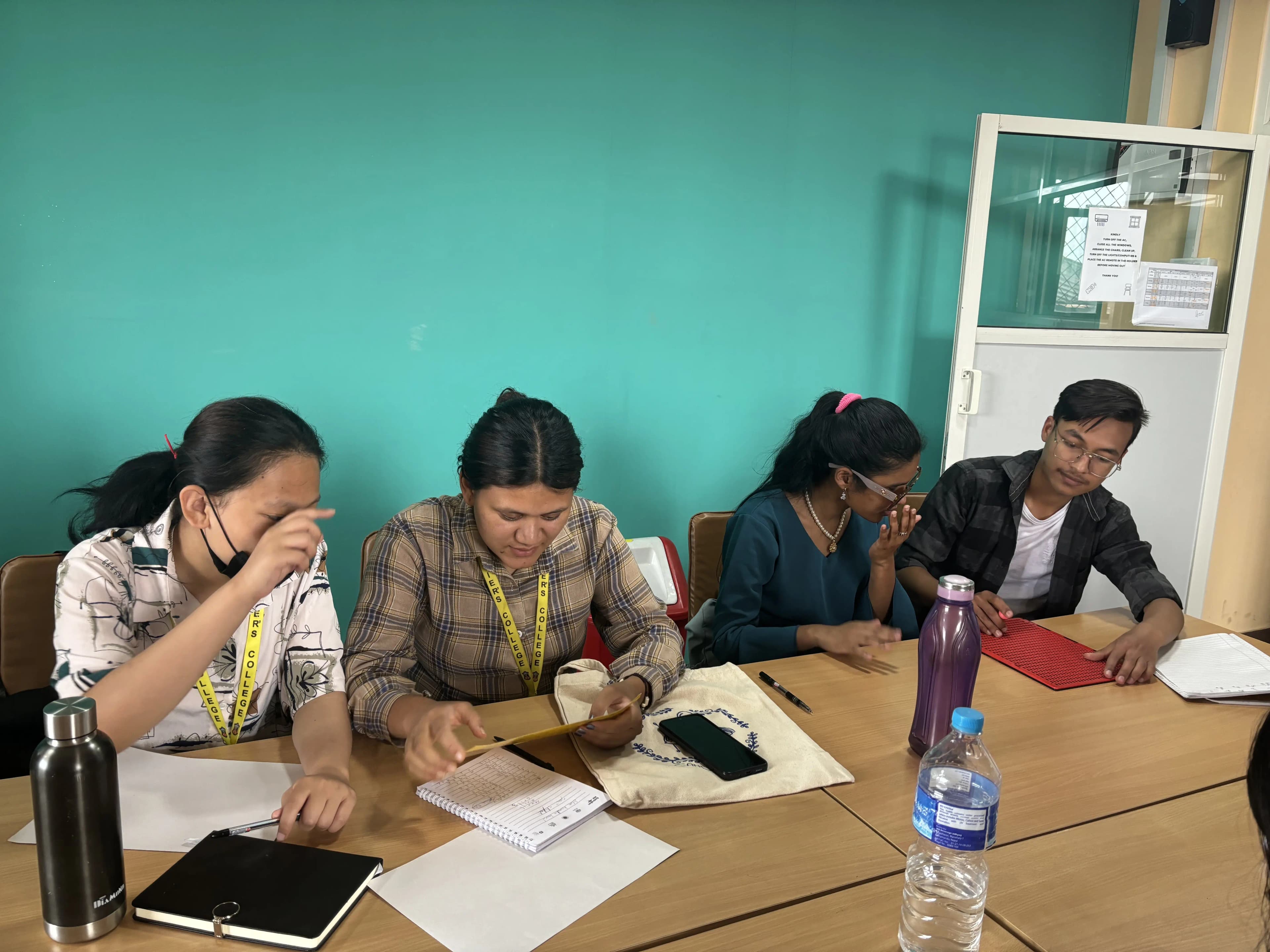 Project members Puspakala Rai and Anysha Roka are studying Braille and Supporting Facilitator Samjhana Rijal is guiding Rayan Karki to write on Braille.
