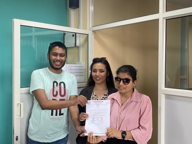 The Founder & President - CFC Abhishek Shahi & Cofounder & Treasurer Sanjiya Shrestha handing over the certificate of appreciation to Facilitator of the workshop Sabitri Paudel.