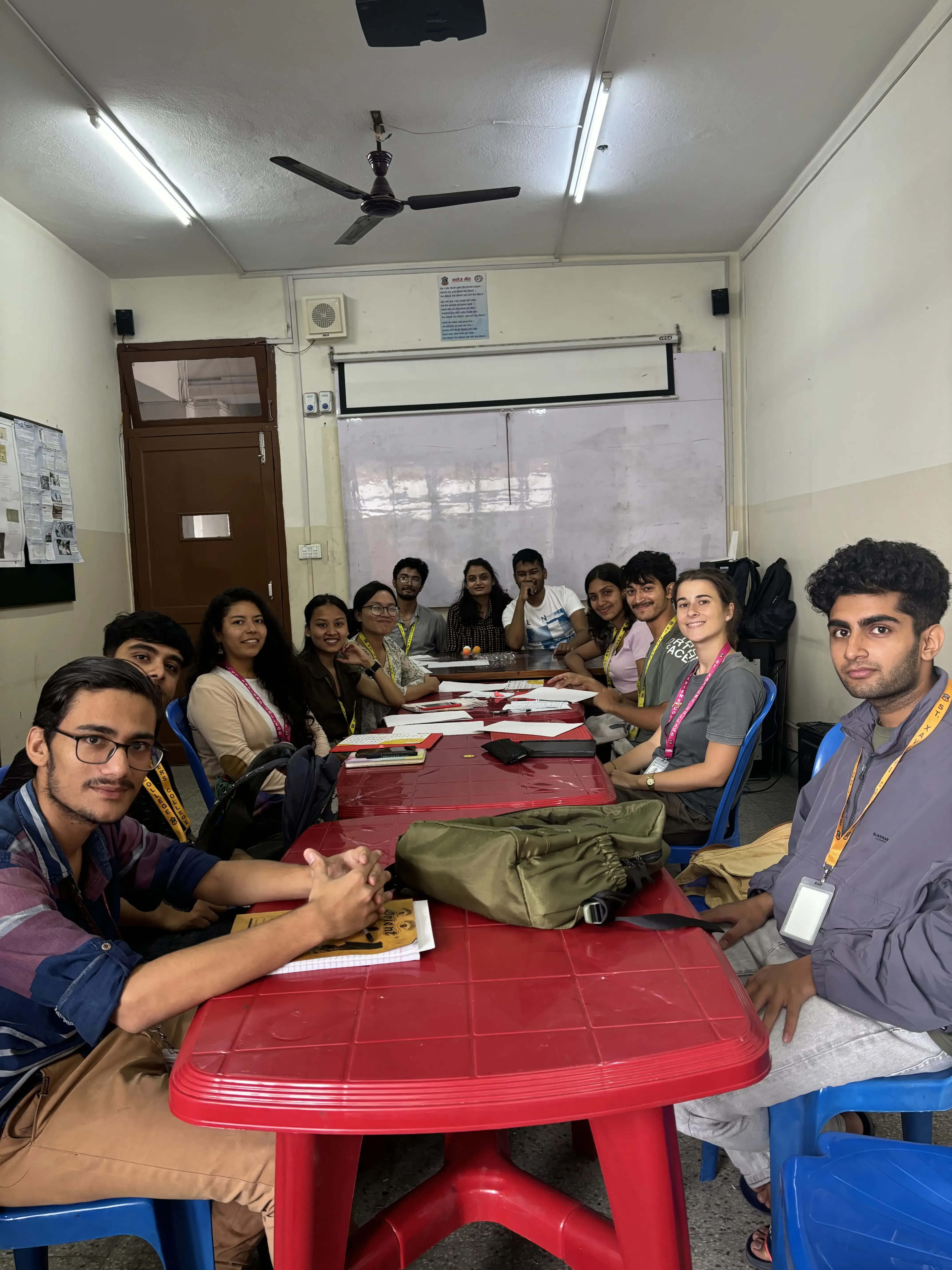 A group picture taken in the braille script workshop consisting of around 12 individuals including the project members, officers and executives.