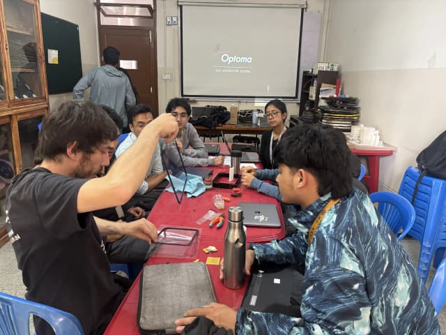 Mr. Miquel Cañada is holding the part of Resin 3D printer and explaining participants to change the Fep.