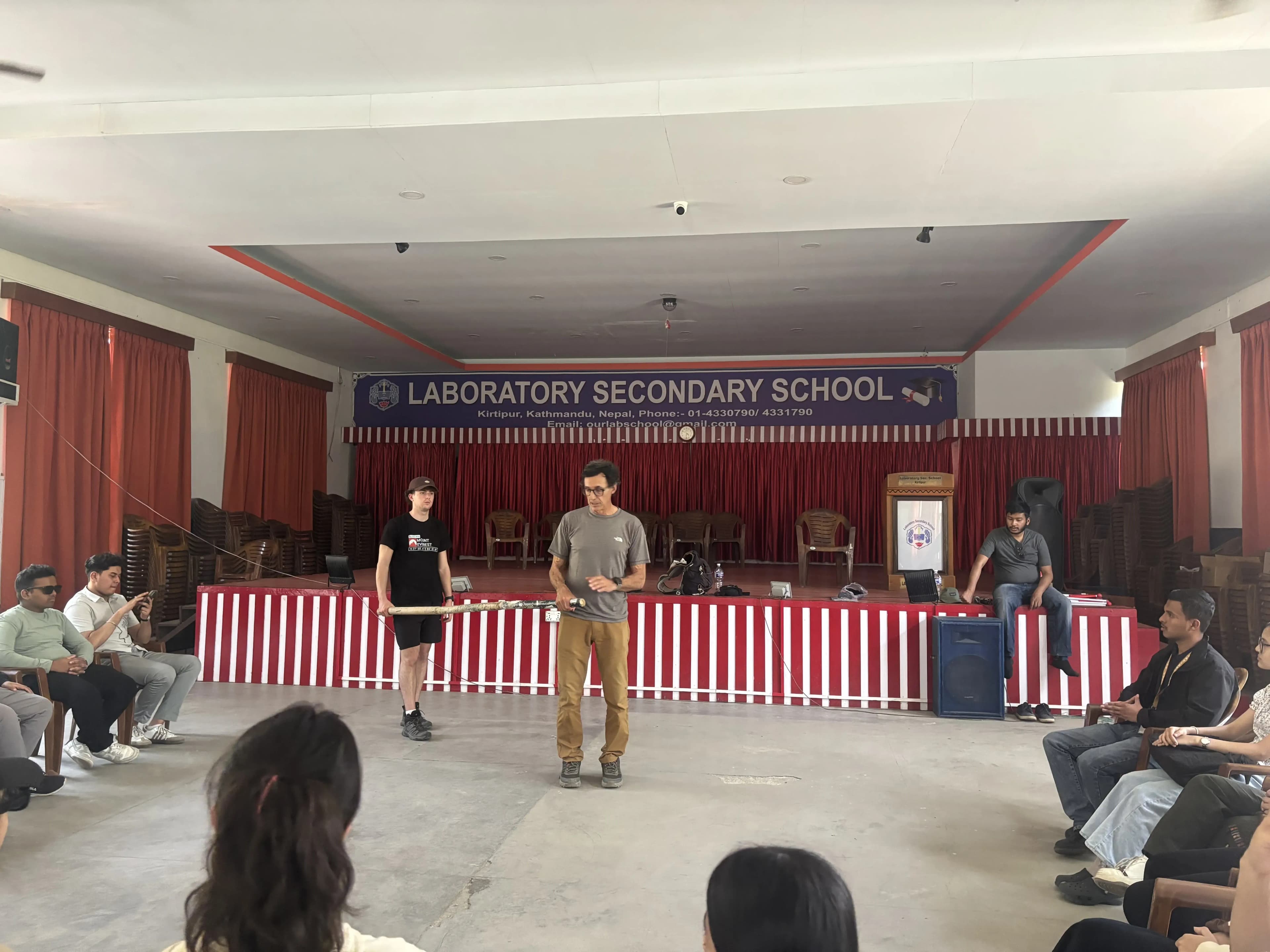 One of the facilitator, Mr. Alfonso Xosé González Cabarcos and his student Mr. Tomas Edgar Requena is holding the long stick and explaining the participants the techniques to use it for guiding. In the background, our Founder, Abhishek Shahi is also observed.