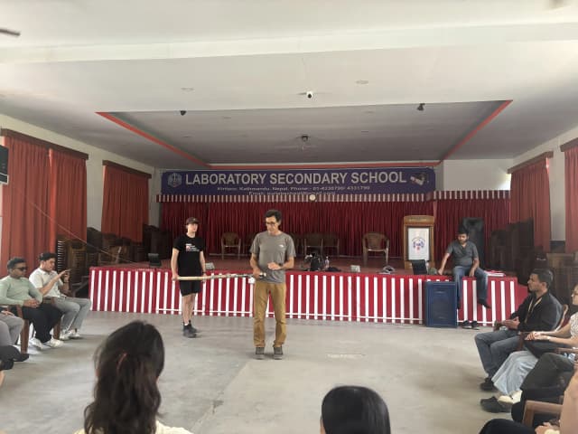 One of the facilitator, Mr. Alfonso Xosé González Cabarcos and his student Mr. Tomas Edgar Requena is holding the long stick and explaining the participants the techniques to use it for guiding. In the background, our Founder, Abhishek Shahi is also observed.