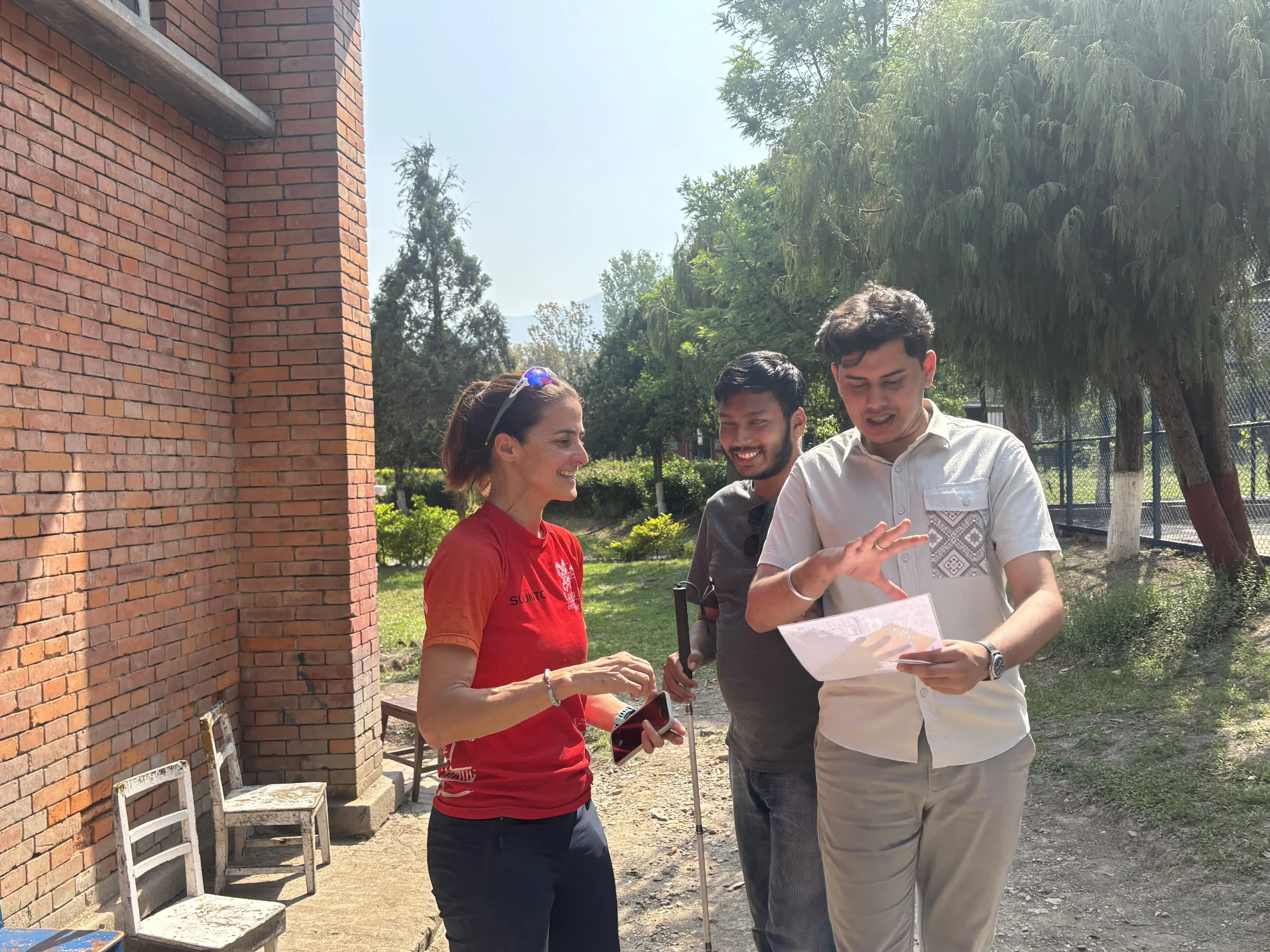 One of the facilitator, Mrs. Kety Balibrea Melero is explaining about the orientating game to the pair of our Founder, Mr. Abhishek Shahi and Officer, Mr. Sangam Khadka. Here the officer is holding the map of the school premises and listening to the instruction of the game.