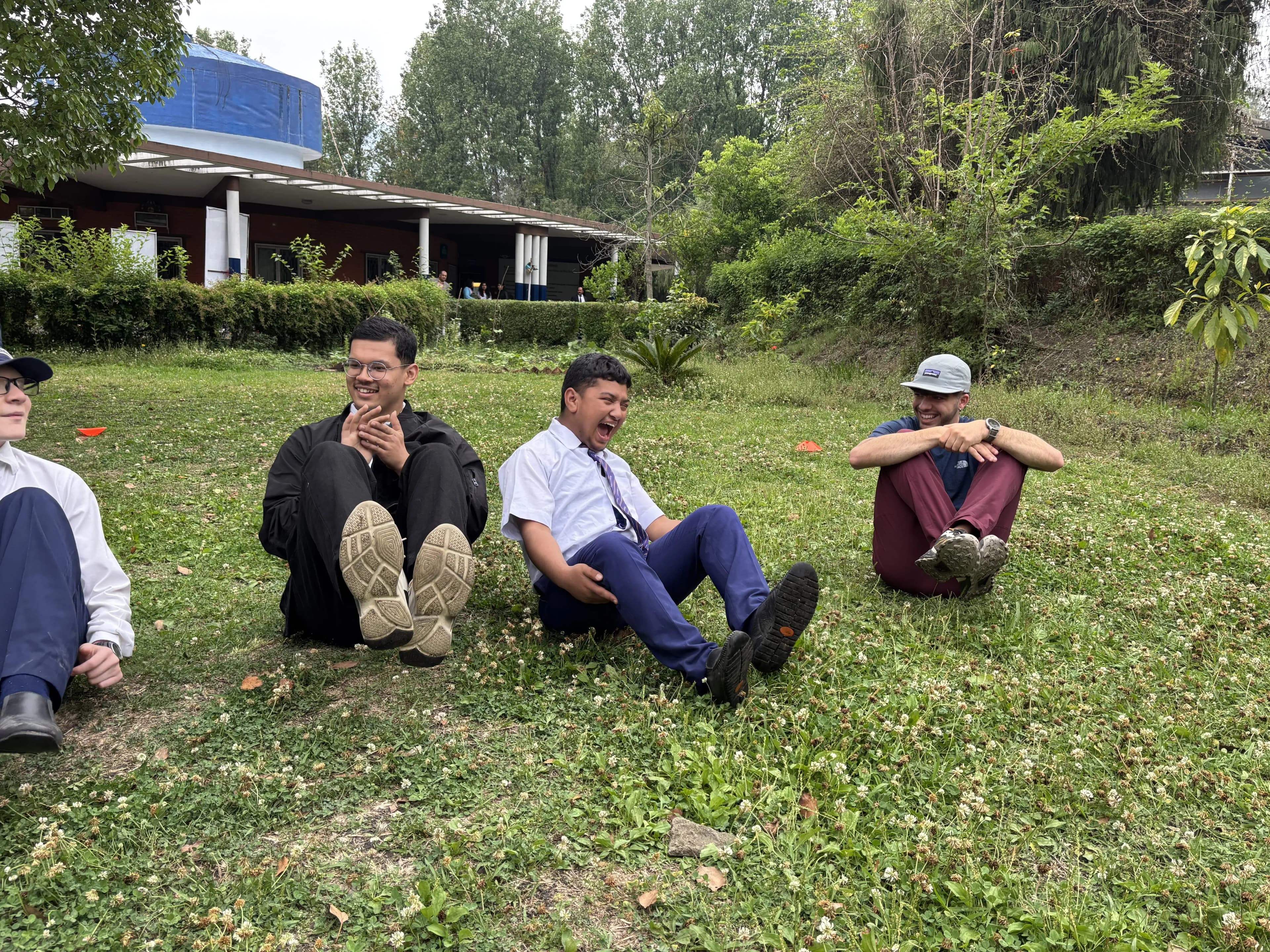 A picture where 3 of the participants are pausing in different position when the music is stopped.