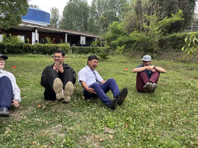 A picture where 3 of the participants are pausing in different position when the music is stopped.