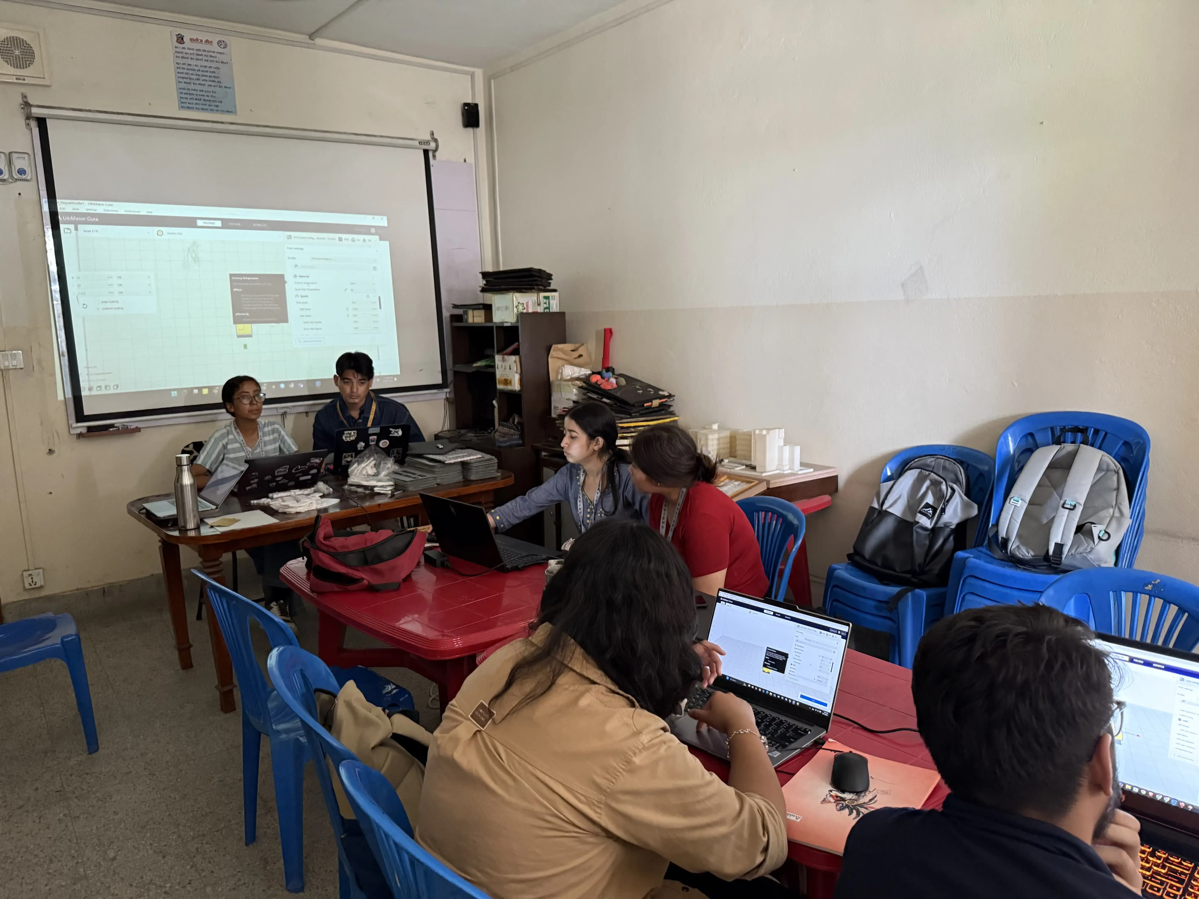 One of the members of computer department (2024/25), Mr. Pralov Malla Thakuri and 3D Design & Printing Officer, Ms. Garima Shakya are facilitating the new project members. Even, 4 of the participants are observed in the picture.