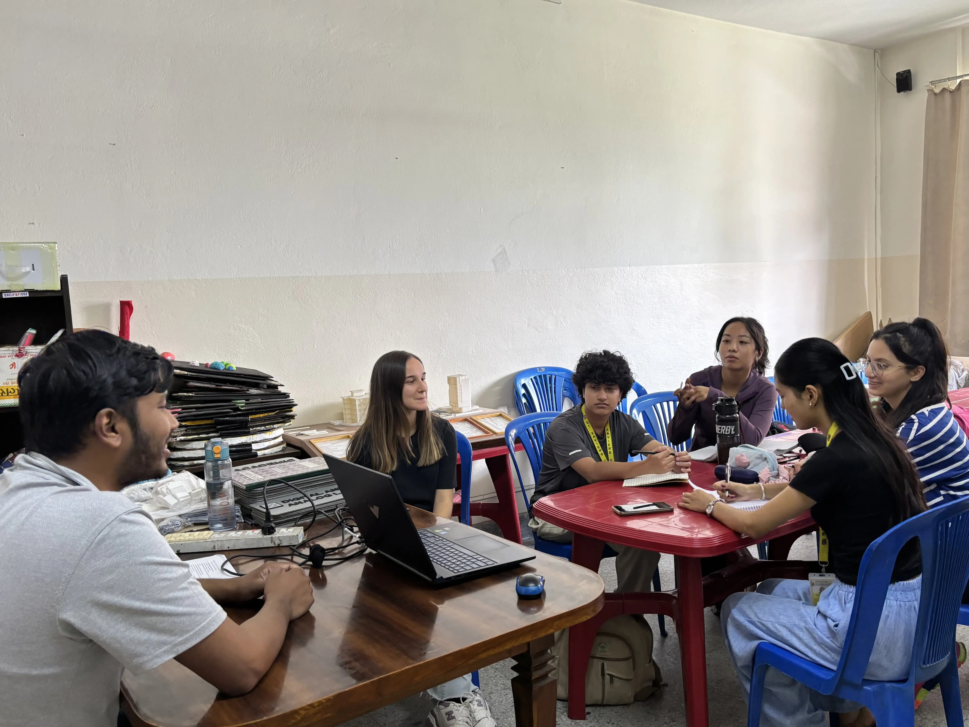 One of the participants, Ms. Sriju Joshi is sharing her views during the workshop. Fellow members and the facilitator is listening to her.