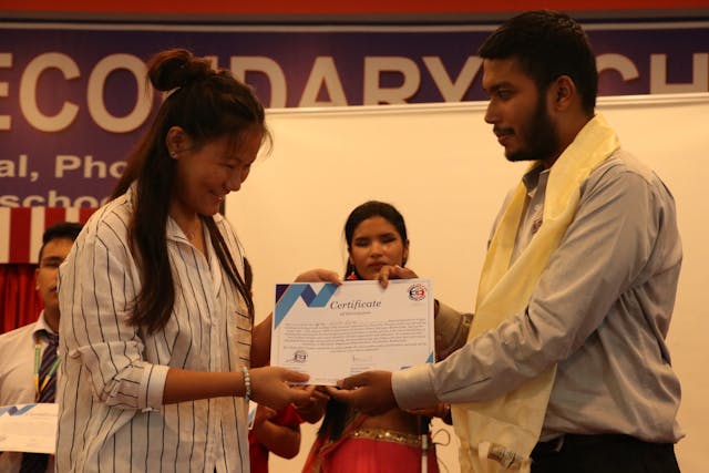Awarding certificate to the guide of participant with visual disability by Founder & Director of Chain For Change Mr. Abhishek Shahi.