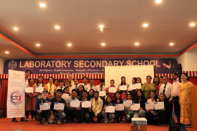 Group picture of all the participants with visual disabilities, guides, teachers of Laboratory School, MCs, Camera crew, Fanny, Mike and Executive Board Members of Chain For Change.