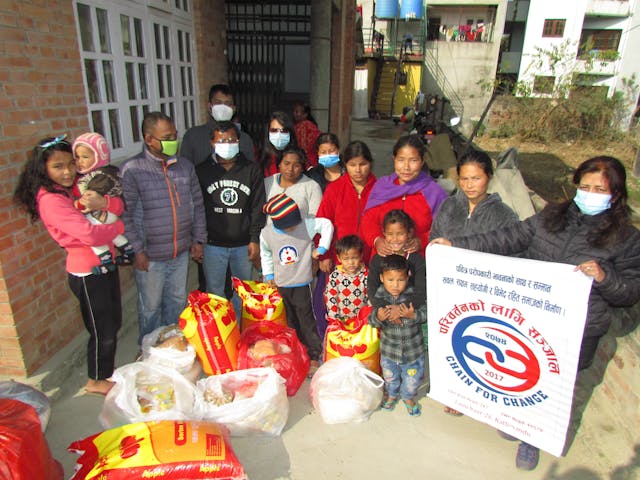 A group picture of families with disabilities and their children along with Chain For Change Executive members during the relief distribution in COVID pandemic.