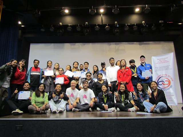 A group picture of all the 11 dancers with visual disabilities and their partners holding their certificates along with dance instructors Dr. Cristina Gomez Vicente and Dr. Guillermo Rodriguez Cortes and organizing members.